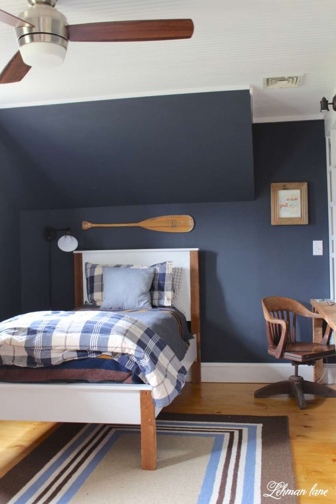 boys bedroom with Halve Navy walls and a twin bed.