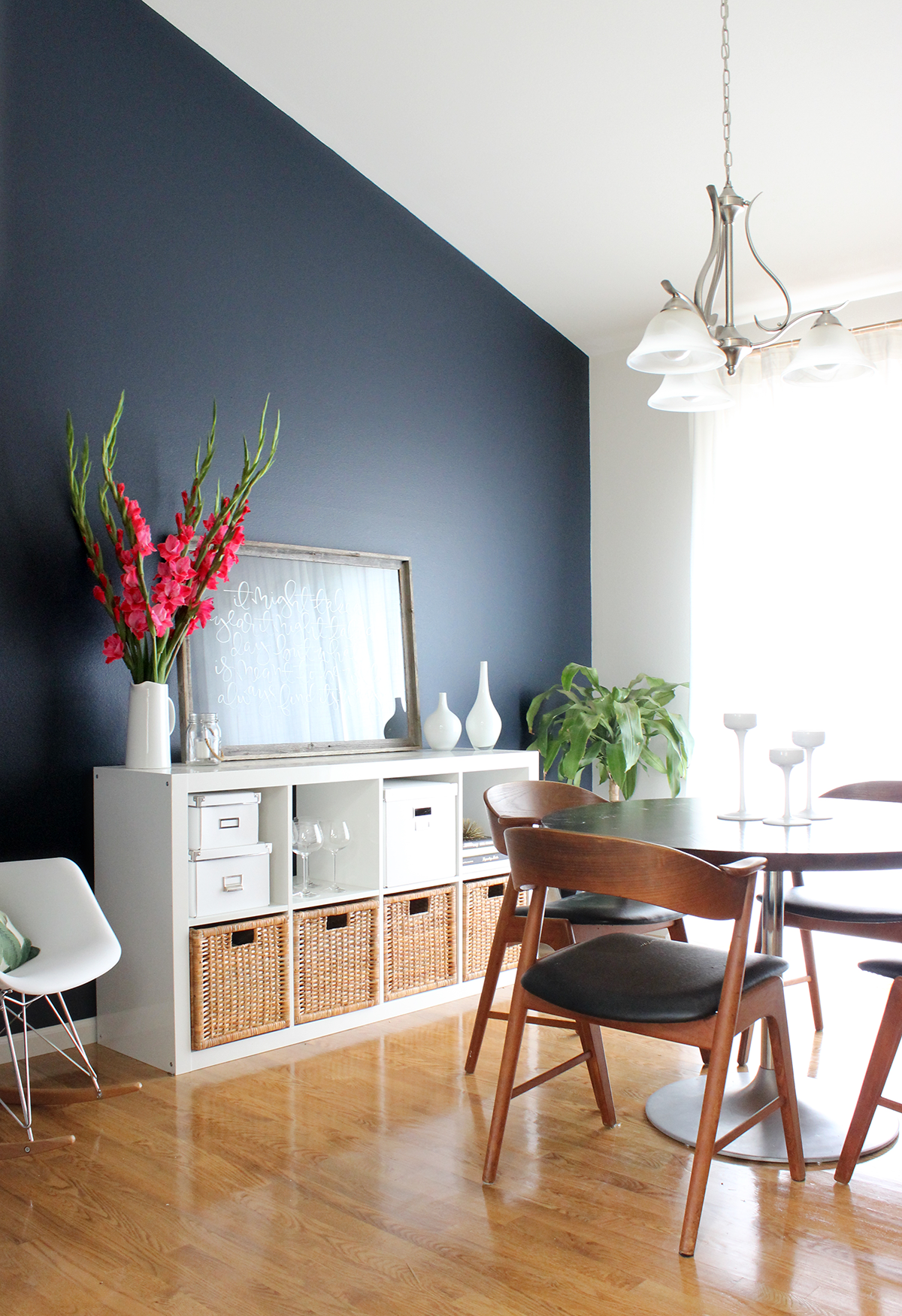 dining room with a navy accent wall
