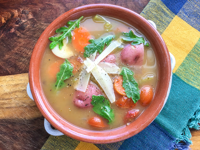 Rustic plant based IP soup in a red bowl