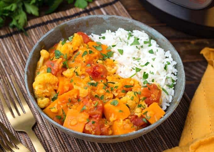 Vegan curry veggies from the instant pot served in a bowl with rice